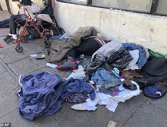 Sleeping people, discarded clothing and used needles are seen in San Francisco that have impacted the dramatic increase in office vacancies