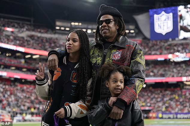 The father of three posed with his two daughters at the biggest sporting event of the year.