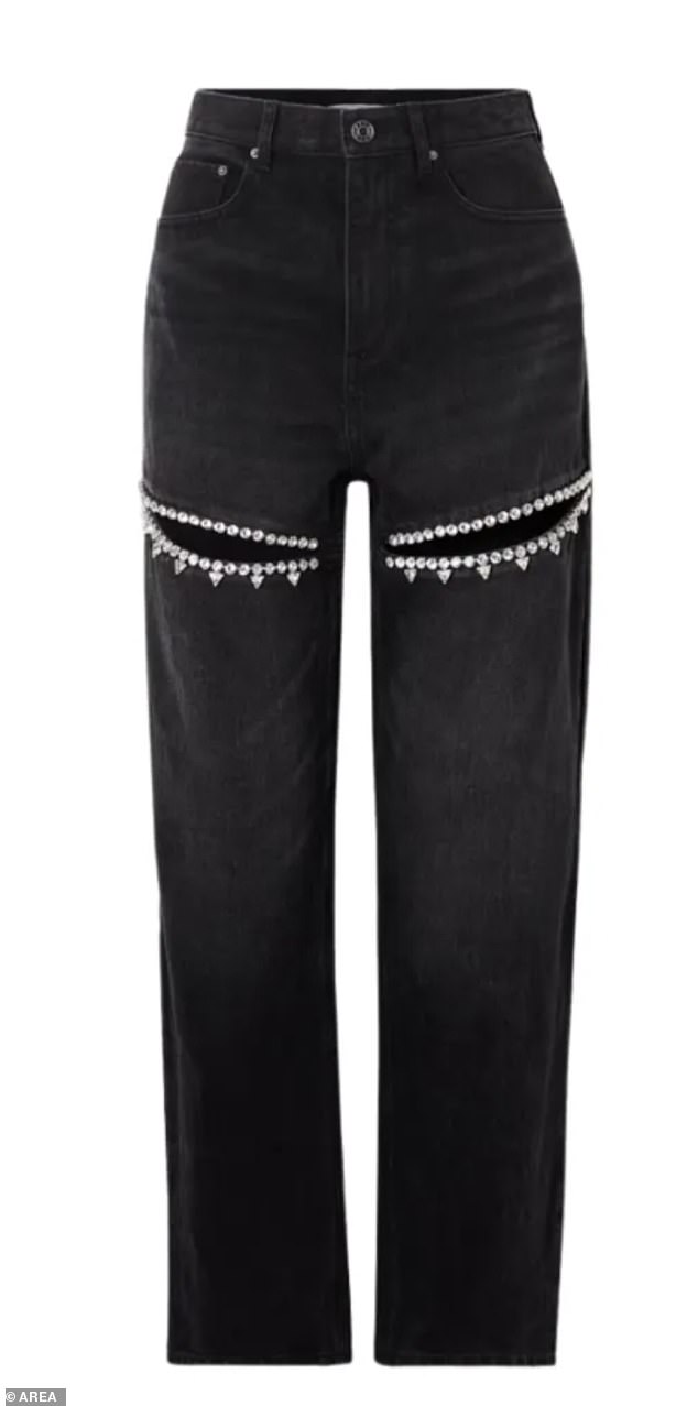 Swift paired the popular Dion Lee crochet corset top ($590) with black thigh-slit jeans with a bedazzled twist from Area ($1,115).