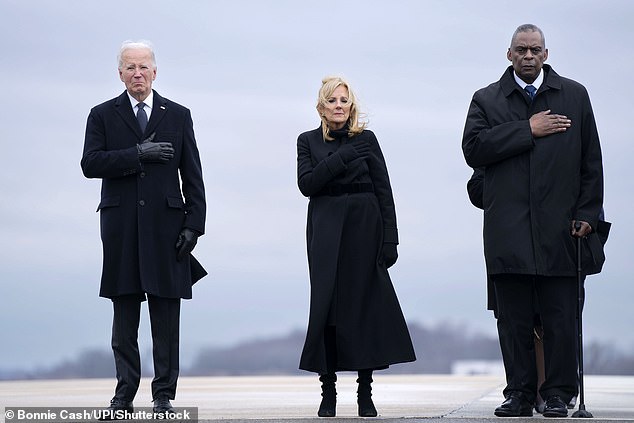 President Joe Biden, first lady Dr. Jill Biden, and Secretary of Defense Lloyd Austin (with a walker) during a dignified transfer at Dover Air Force Base, Delaware, of the corps three US soldiers killed in a drone strike in Jordan last month.