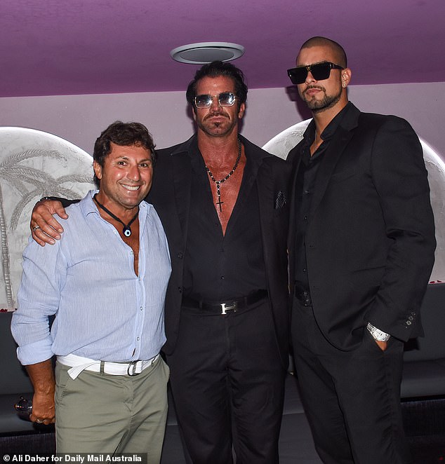 Also attending the party was MAFS' ex-boyfriend Nasser Sultan (left), who posed arm-in-arm with tobacco magnate Travers 'Candyman' Beynon (centre) and his son Valentino (right).