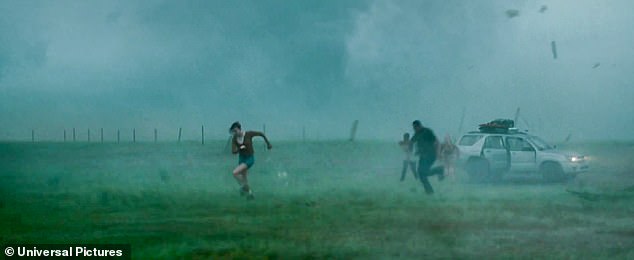 The trailer begins with a team of meteorologists driving through a rainy tornado, and the team is forced to abandon their vehicle and take shelter after their vehicle is hit by flying debris.