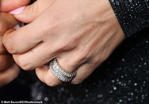 Pippen was seen putting on the jewel-encrusted band on the ring finger of her left hand.