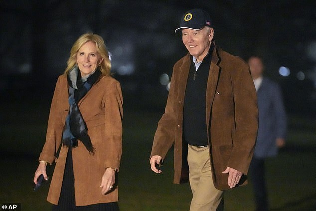 President Joe Biden and first lady Jill Biden walk on the South Lawn of the White House, Sunday, Feb. 11, 2024, in Washington, after returning from a trip to Delaware.