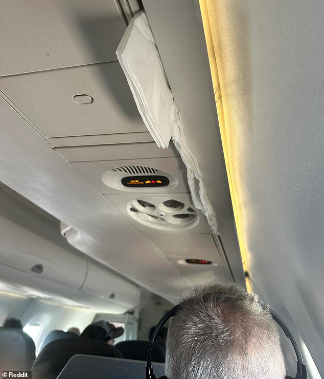 The passenger also has an air conditioning vent filled with napkins (pictured) and a blind that appears to have been splattered with food.