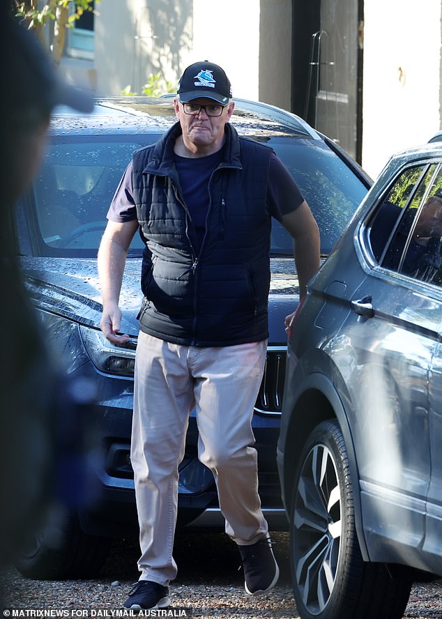 On Saturday it looked like Morrison was finally moving out of Kirribilli after he was seen leaving the residence with one of his daughters (pictured, Morrison is sporting a Cronulla Sharks cap).