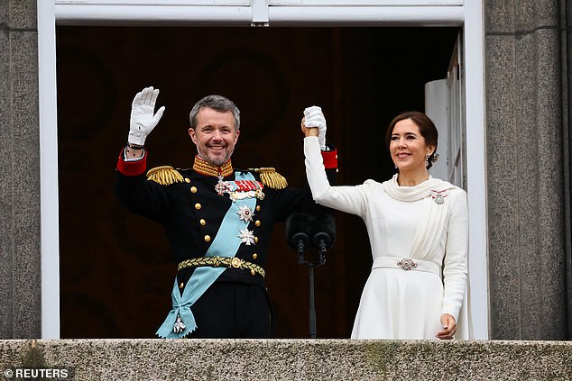 The new king and queen of Denmark smile at the crowd at Christiansborg Castle