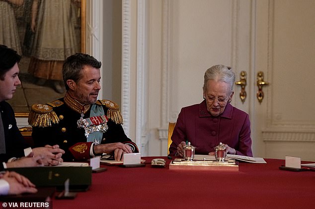 Queen Margaret signs a declaration of abdication at the Council of State at Christiansborg Castle, after a reign of 52 years