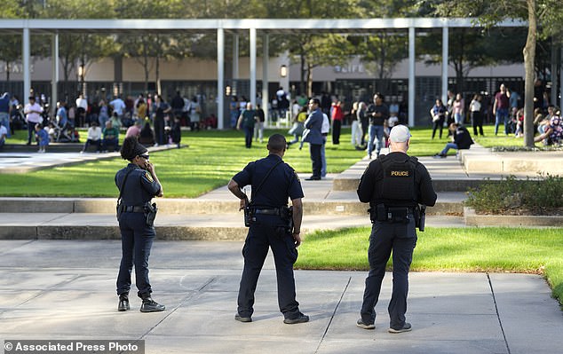 Worshipers could be seen leaving the building as authorities evacuated the church ahead of the news conference.