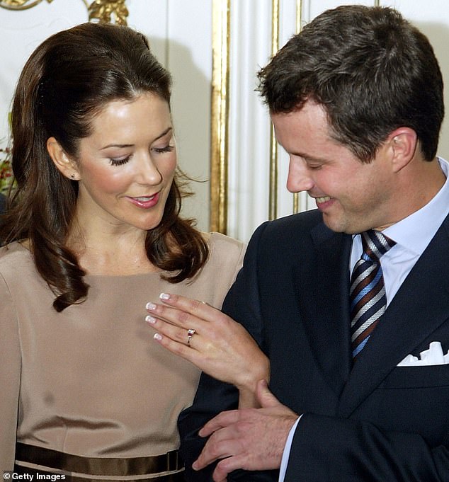 Princess Mary shows her engagement ring to the media during a press conference at Fredensborg Castle on October 8, 2003.