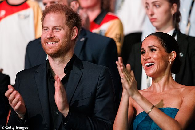Prince Harry and Meghan are seen during the closing ceremony of the Invictus Games in Dusseldorf, Germany, last year.