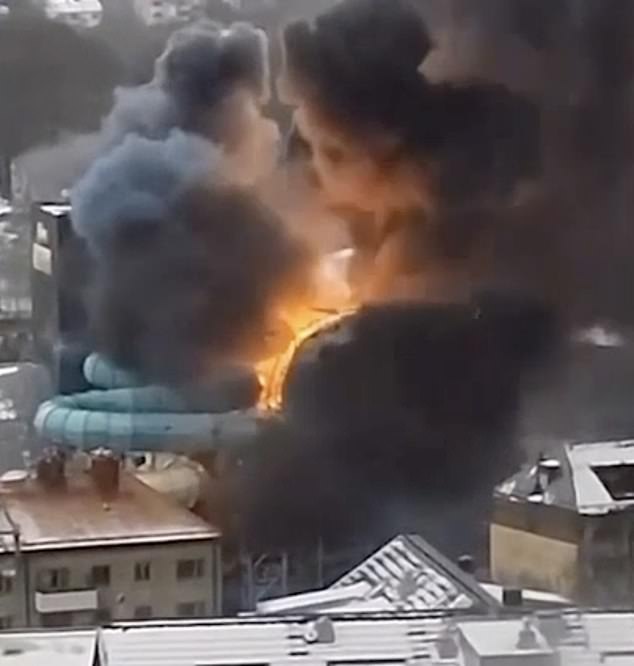 Explosion seen on water park slide behind snow-covered houses