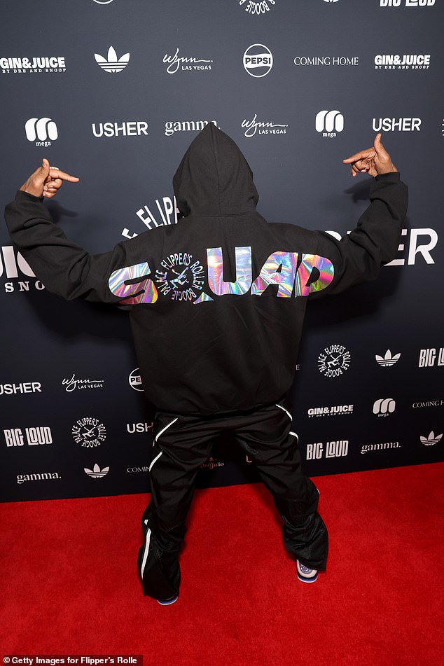 The hitmaker wore a black hoodie with the word 