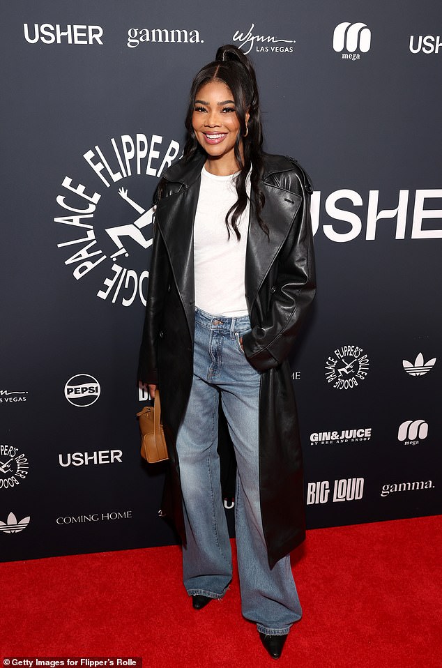 Gabrielle Union looked chic as she tucked a plain white blouse into a pair of blue jeans.