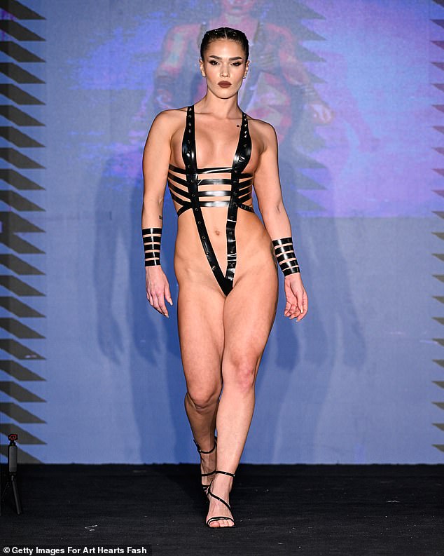This bandage-inspired jumpsuit featured narrow strips of black tape wrapped around the body.