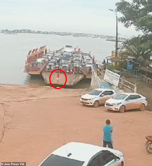 The horrific moment was captured on CCTV and shows how the man jumped the gate separating the cars from the ramp as the ship approached the port.