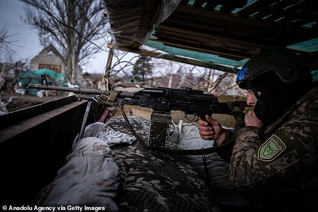 A Ukrainian soldier from the Ukrainian Volunteer Army is in a fortified position, in an undisclosed location next to the Vuhledar front.