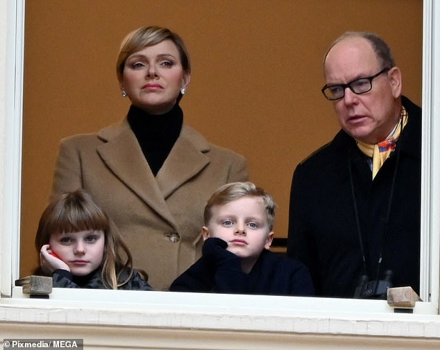 The royal family watched the parade from a window before heading down to the street to enjoy the attractions.