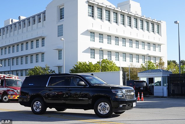 Former President Donald Trump arrives at Federal Court Monday, Feb. 12, 2024, in Fort Pierce, Fla., for a closed-door hearing in his criminal case accusing him of mishandling classified documents.