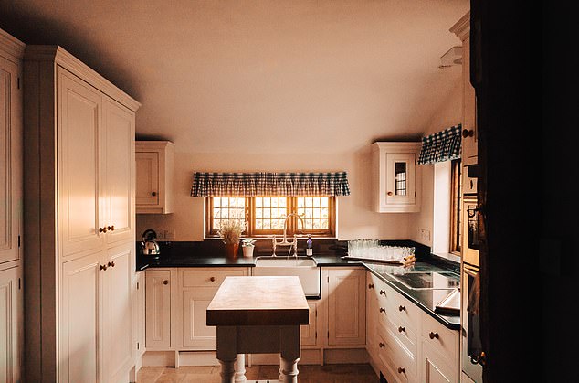 The morning sun enters through the window in a corner of the huge kitchen-dining room.