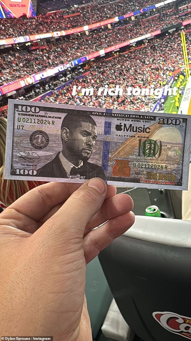 Dylan shared a photo of a souvenir from the halftime show: a $100 bill with Usher's face on it. 