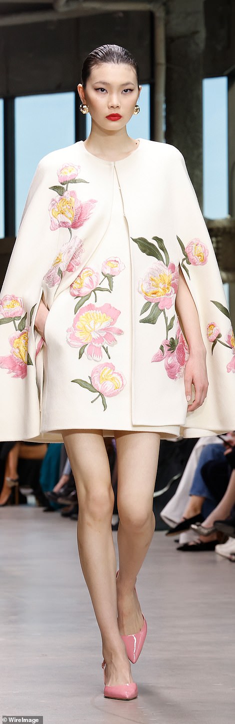 Another theme on the runway was cape coats, with flower-printed versions.
