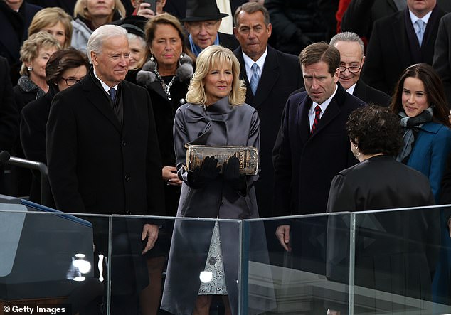 Joe Biden is sworn in as vice president in January 2013 as his wife Jill Biden and son Beau Biden watch him take the oath of office.