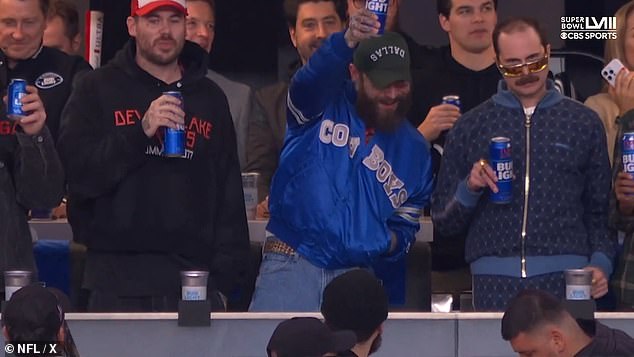 The American rapper and singer put on his Cowboys jacket later and wore it to the game.