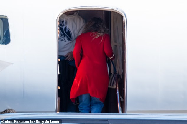 She was joined on the plane by actress Blake Lively, seen boarding in a red coat.
