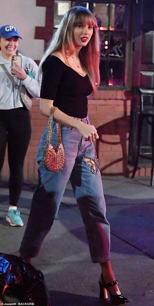 Taylor was spotted dining at celebrity hotspot Via Carota in the brand's bold butterfly-cut denim after splitting from Joe Alwyn in April.