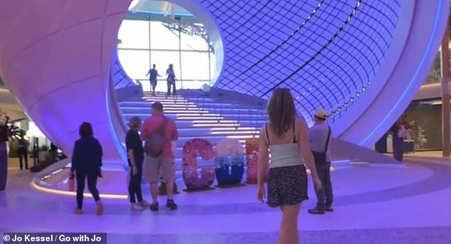Here Jo is shown looking at Icon's Pearl feature: a giant three-story sphere installation that you can walk through.