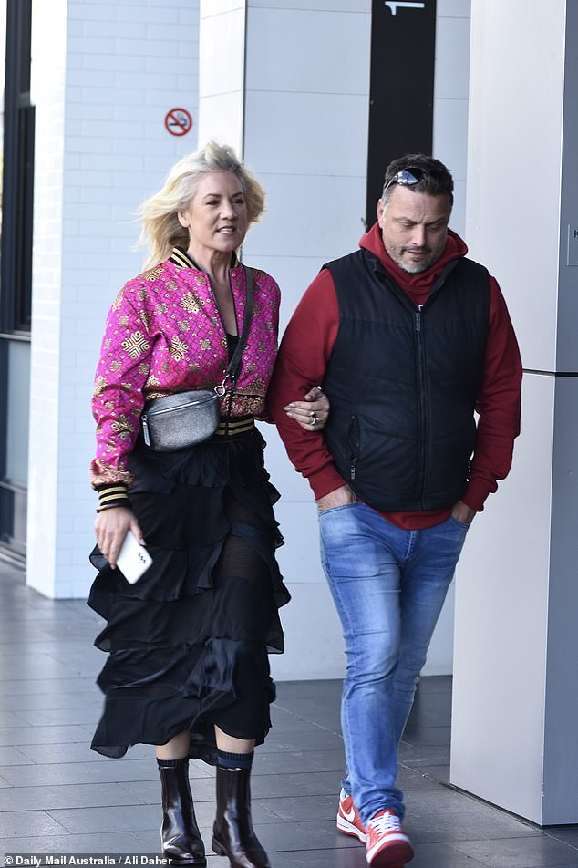 The free-spirited bride, 43, and her boyfriend, 51, looked loved-up during a brief stroll outside their Skye Suites apartment in Sydney.