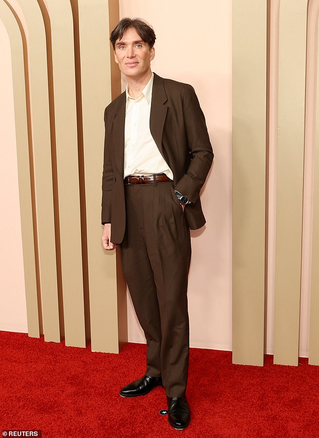 Cillian looked dapper in a white shirt and brown suit at the event.