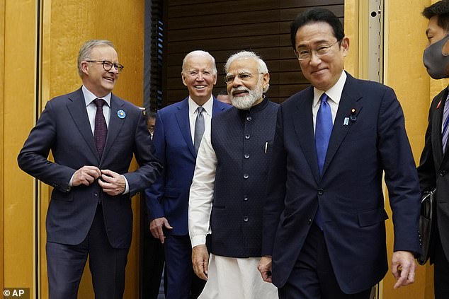 Australian Prime Minister Anthony Albanese, left, US President Joe Biden, Indian Prime Minister Narendra Modi, are greeted by Japanese Prime Minister Fumio Kishida, right.