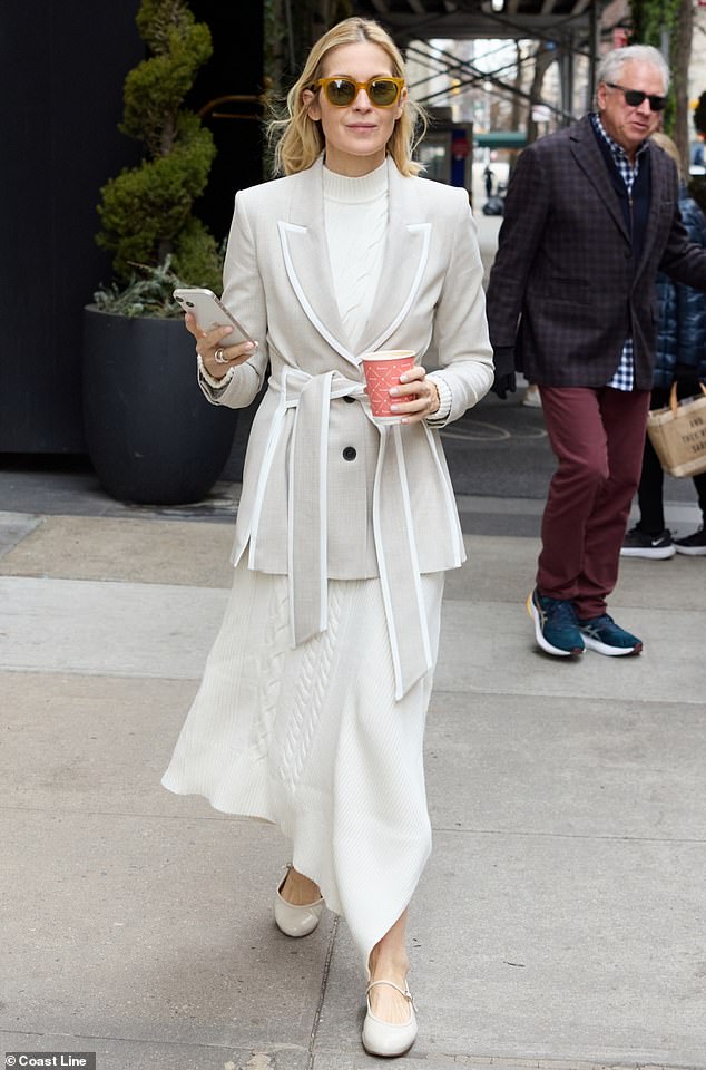 The Gossip Girl star, 55, looked chic in a long ivory knit dress as she stepped out in Manhattan.