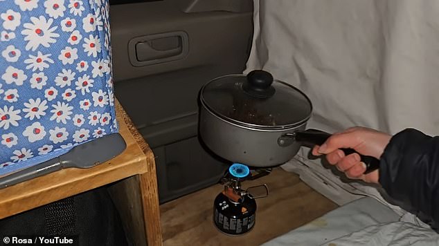 For dinner, Rosa heated a pot of chili over a flame in the back of her car.