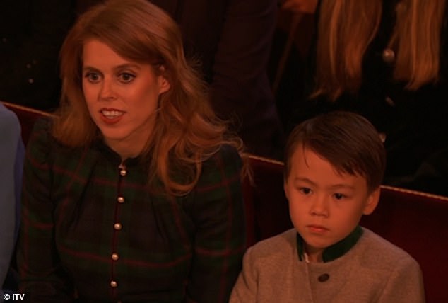 Seven-year-old Wolfie sat next to his stepmother and cousins ​​at the concert.