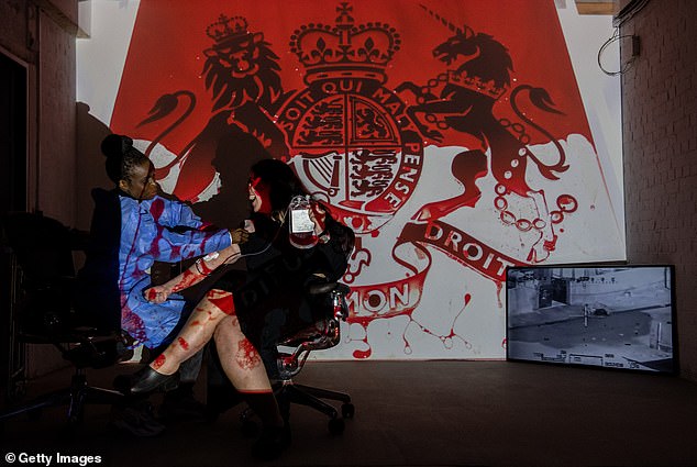Afghans and Iraqis donated blood for an artwork by Molodkin titled Real Blood.  The sculpture was projected onto St Paul's Cathedral in protest against Prince Harry's role in the war in Afghanistan.