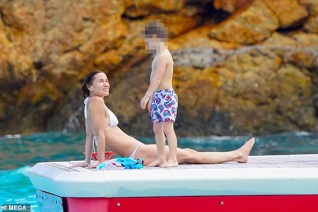 Pippa Middleton is seen enjoying lying on a trampoline with her son Arthur, while her sister recovers from abdominal surgery.
