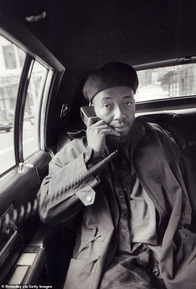 Simmons speaks on the phone in Manhattan in 1991