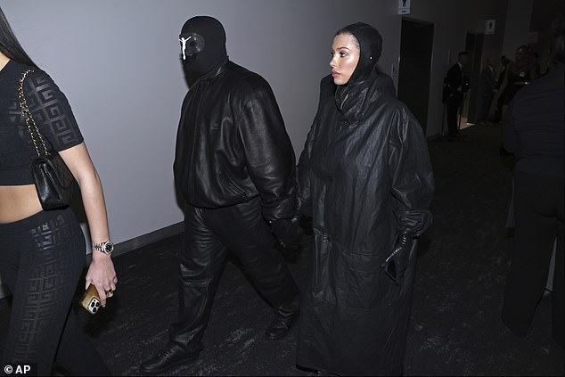 Kanye arrived at the Super Bowl with photos showing him and his wife, Bianca Censori.