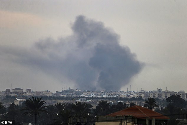 Smoke rises after an Israeli airstrike during a military operation in the town of Khan Younis in the southern Gaza Strip.
