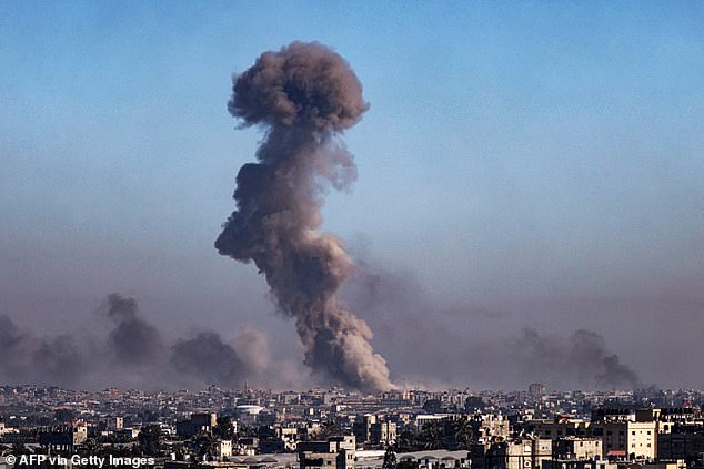 A photograph taken from Rafah shows smoke rising during the Israeli bombardment of Khan Yunis in the southern Gaza Strip.