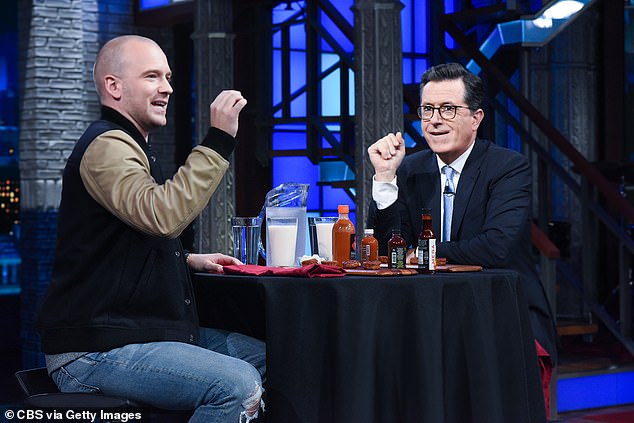 Evans is known for hosting Hot Ones, where his guests answer his questions while trying to eat 10 chicken wings, each of which is drizzled with a progressively spicier sauce; seen doing a mini version of him on The Late Show with Stephen Colbert in 2017