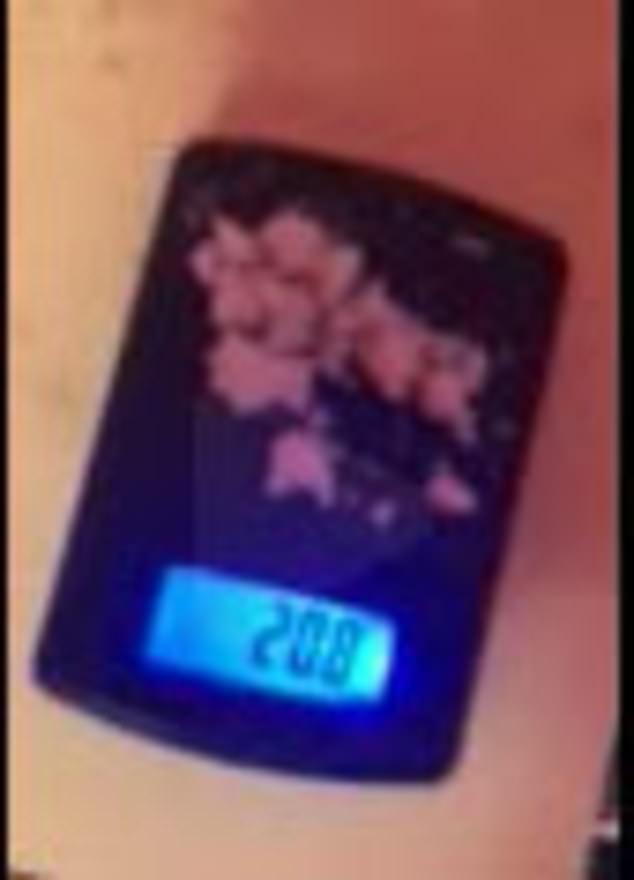 What appears to be cocaine is weighed. This image was found on Hunter Biden's iPhone and was attached to a Tuesday filing from the Department of Justice.