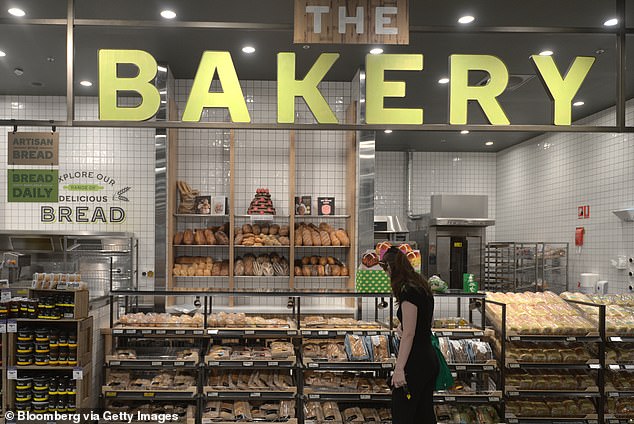 Customers were skeptical that the images were legitimate, as the woman's uniform and the bakery's signs looked nothing like what shoppers typically see in Woolies stores.