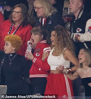 Taylor raised her arms in the air as she cheered on her Kansas City Chiefs boyfriend, Travis Kelce.
