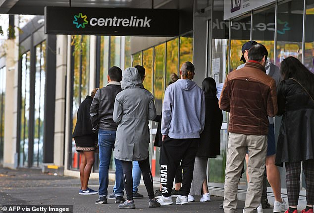 Millions of Australians will receive a pay rise after the ALP leader pledged to increase the minimum wage by 5.1 per cent to help tackle the cost of living crisis (pictured, Australians queue outside Centrelink in Melbourne)