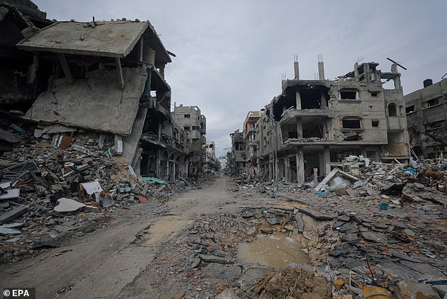 Houses destroyed during an Israeli military operation in the Al Bureije refugee camp, southern Gaza Strip, February 13, 2024