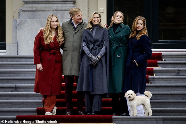 Part of the family!  Mambo posed perfectly for a family photo alongside Princess Amalia, King Willem-Alexander, Queen Máxima, Princess Ariane, and Princess Alexia.